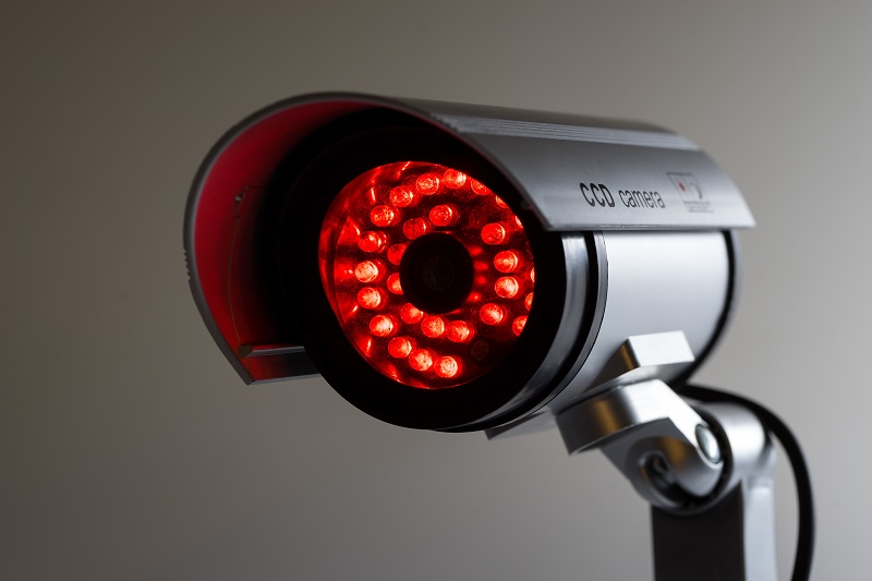 Security camera with red blinking light.