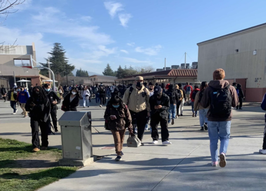 Students walking with masks on at Washington High School.
